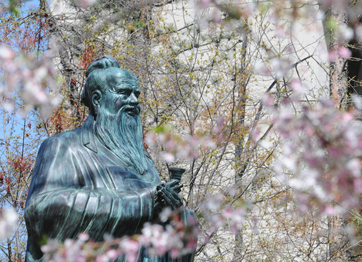 A bronze statue of Confucius on George Mason University Fairfax Campus
